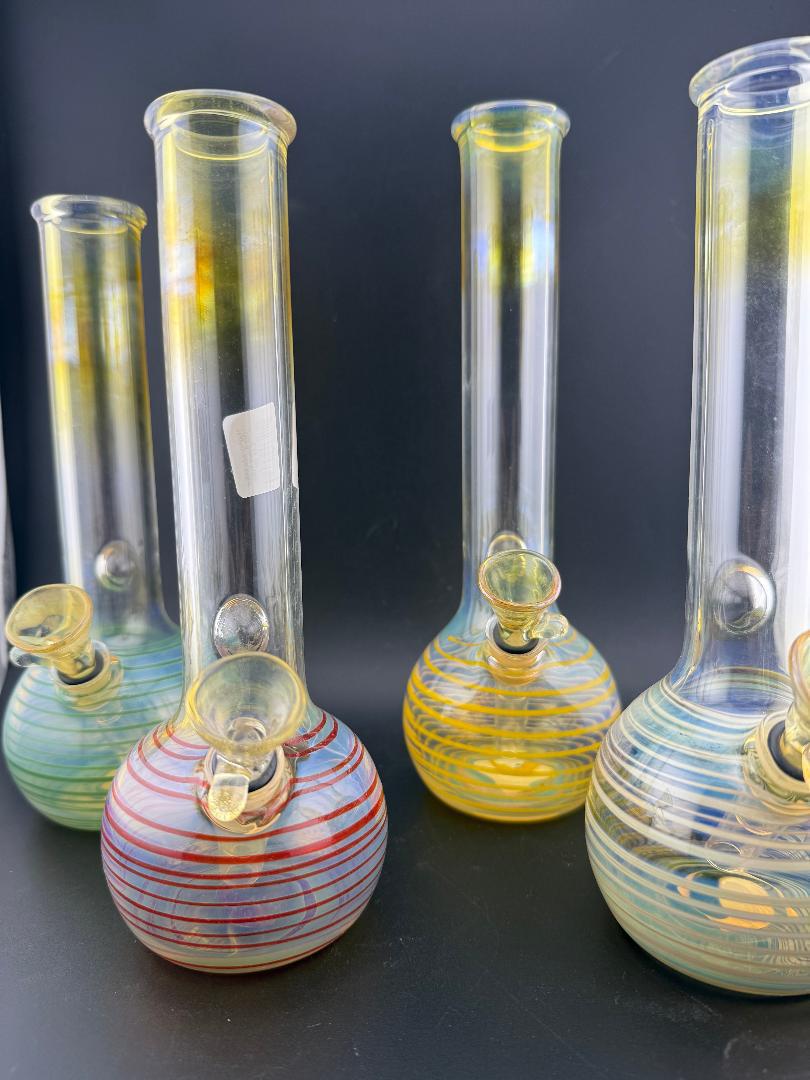 Highgrade Glass OG 9mm Tube Slide Gromit Fitting displayed in assorted colors and designs.