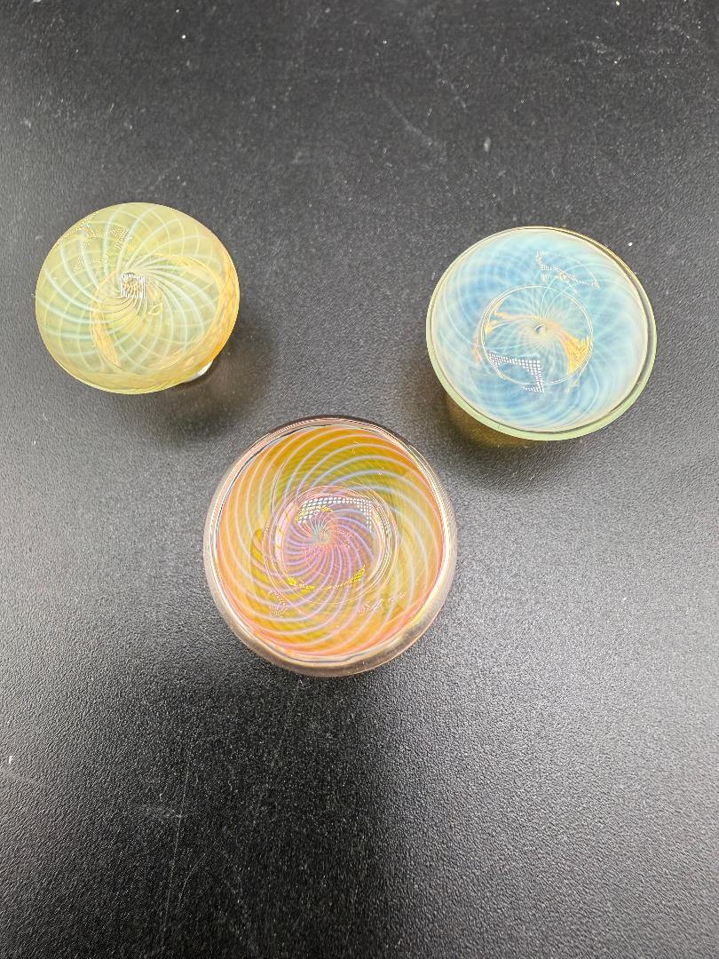 Phatt Mat Glass Fumecello Terp Slurper Caps featuring vibrant spiral designs for enhanced dabbing experience.