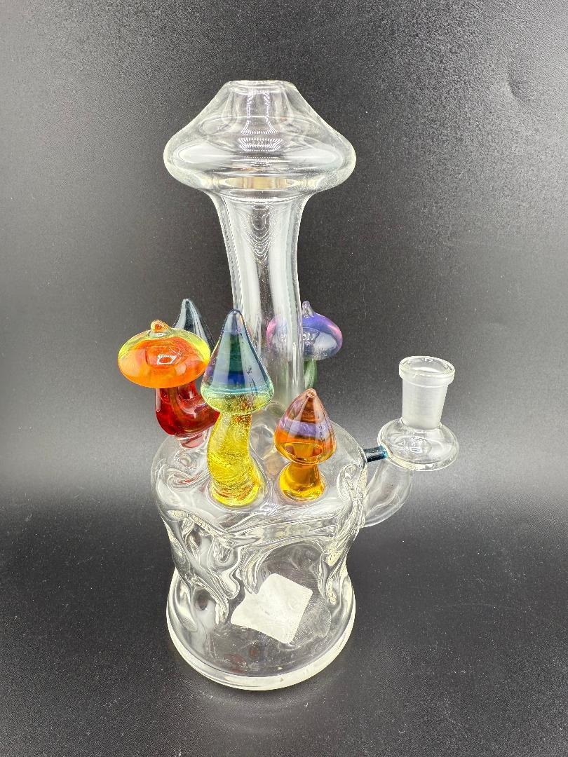 Brando Glass Swiss Cheese (Moon Crater) Rig – 10mm 90° featuring colorful mushroom accents and unique design.