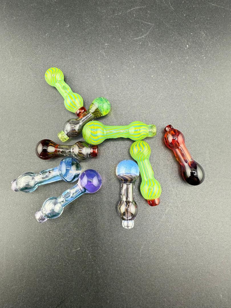 Paulson Pieces Puffco Proxy Ball Cap Replacement handcrafted glass accessories in various colors on a black background.