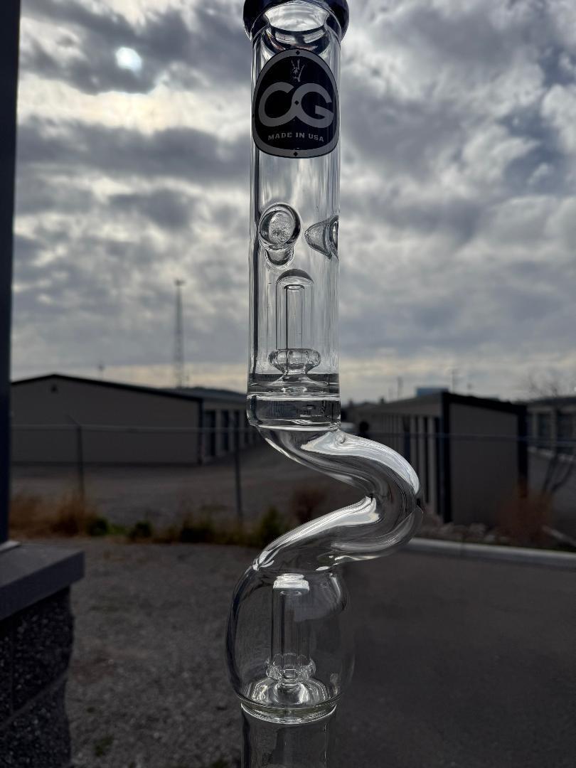 Compton Glass Zong 26" w/ Double Perk 14mm 45° showcasing unique design against cloudy sky.