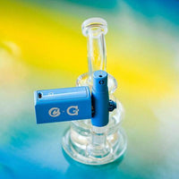 G Pen x Cookies Connect Vaporizer Kit (Coming Soon) with blue design on a glass bong.