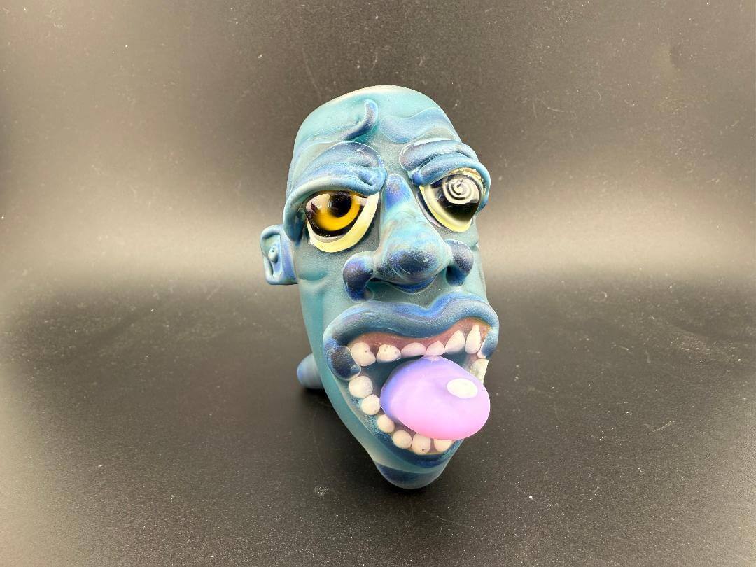Crondo Face Pipe Sherlock with vibrant blue design and unique facial features, showcasing creativity in smoking accessories.