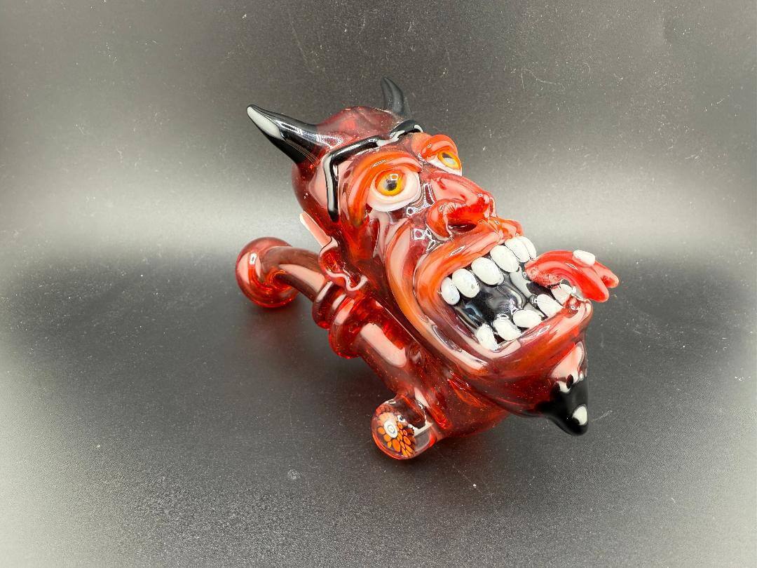 Crondo Face Pipe Sherlock - unique glass smoking pipe with a devilish design in vibrant red and black colors.