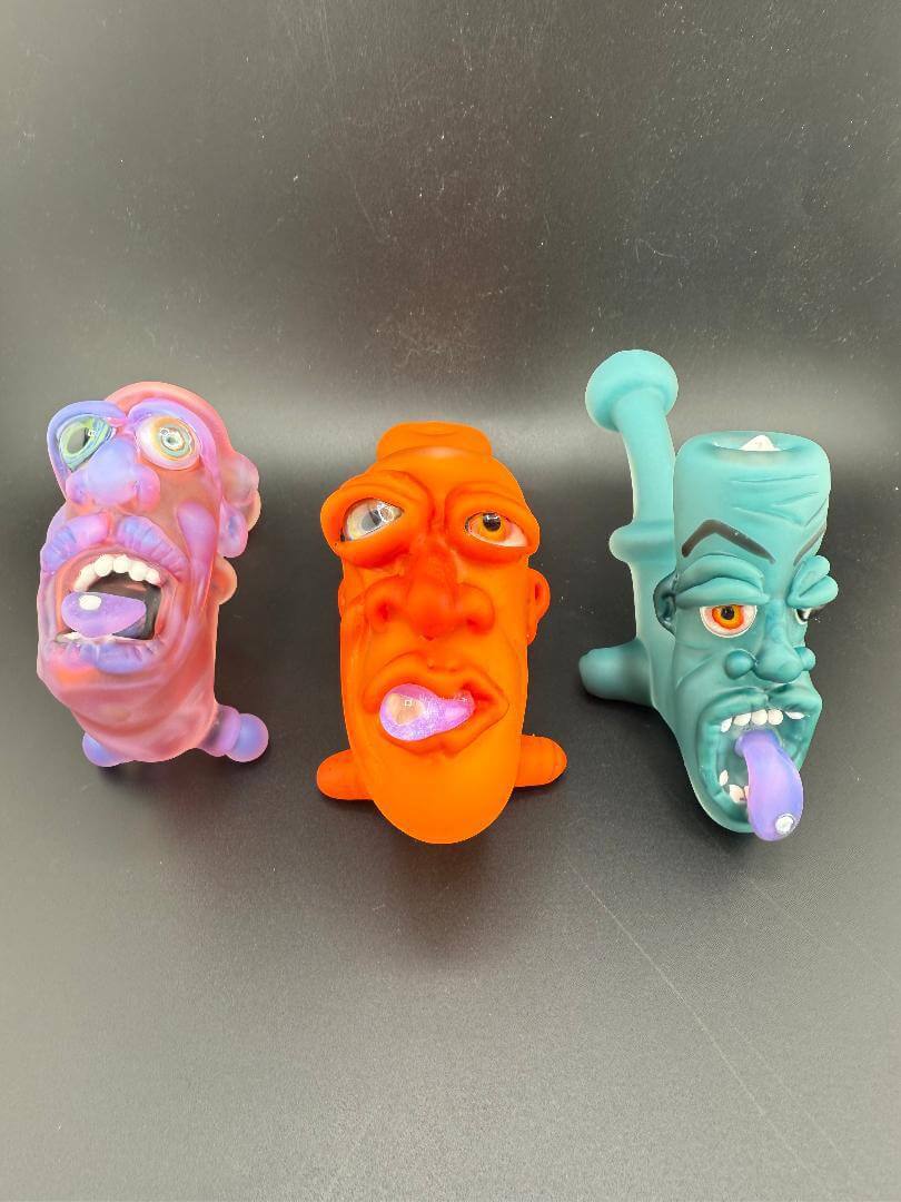 Crondo Face Pipe Sherlock collection featuring three colorful, unique face-shaped pipes.