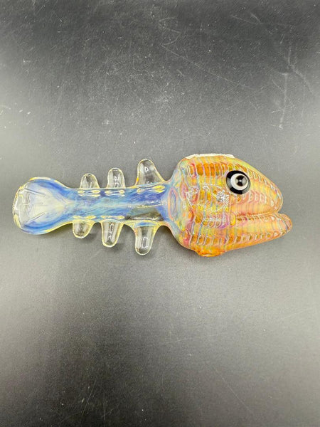 Crondo Glass Hand Pipe - Fumed Fish Skeleton, hand-sculpted glass with intricate fish design, color-changing properties.