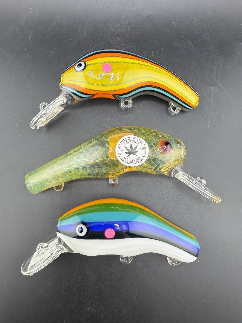Crondo Glass Hand Pipe - Lined Tubing Fish Lure featuring vibrant, multi-colored designs of fishing lures.