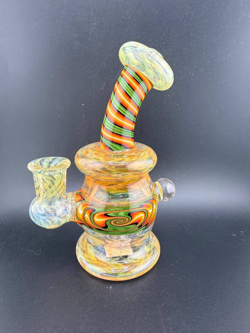 Colorful handcrafted glass water pipe with spiral striped neck and vibrant swirling patterns.