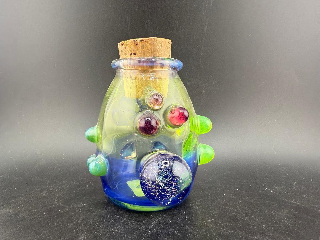 Crondo Glass Nug Cork Jar - 420 Blue & Green featuring vibrant blue and green tones with a cork lid.