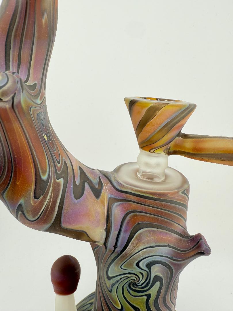 Crondo Glass Sandblasted Tree Stump Bubbler close-up showcasing intricate design and colorful swirling patterns.