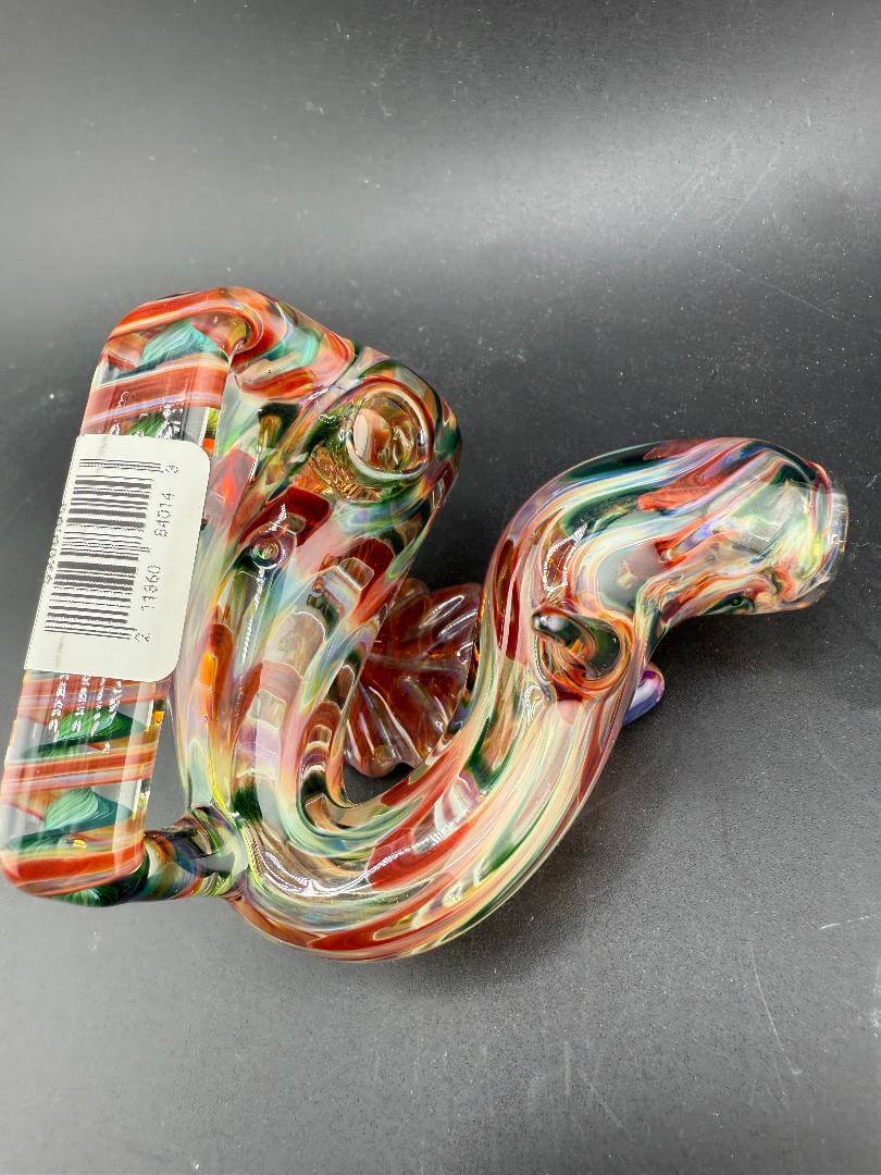 Crondo Glass Sherlock Pipe - Green, Amber & Red w/ Leaf Attachment Belt Buckle shown from above, highlighting vibrant colors.