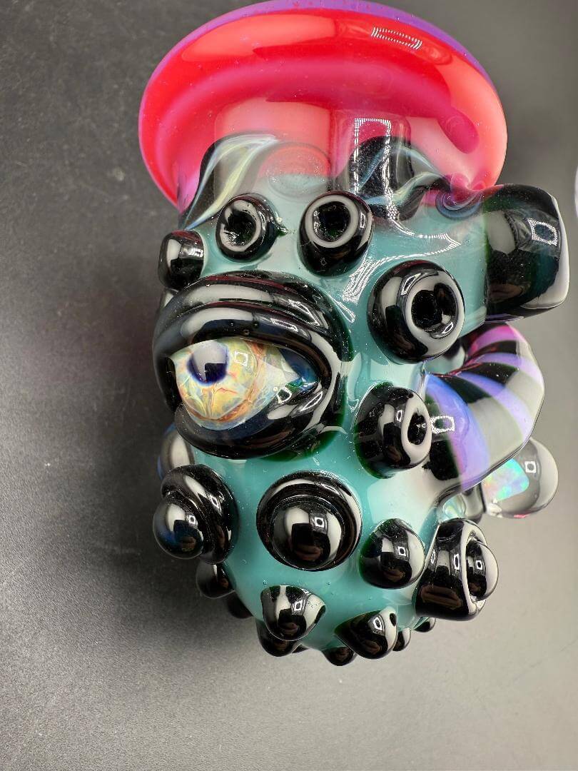 Crondo Glass Sherlock Pipe - Hotpink & Teal w/ Eyeball, Line Worked Horns & Sculpting showcasing vibrant colors and intricate details.