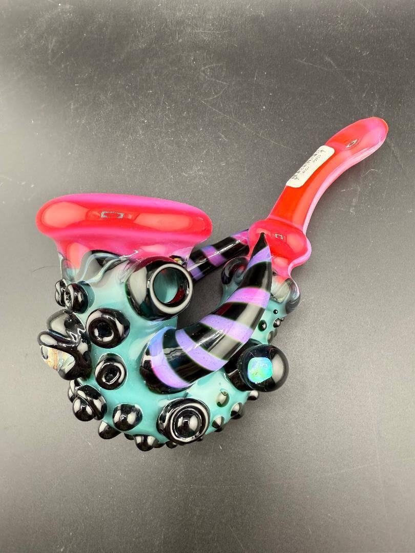 Crondo Glass Sherlock Pipe - Hotpink & Teal w/ Eyeball, Line Worked Horns & Sculpting on display