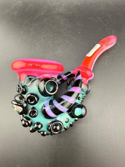 Crondo Glass Sherlock Pipe - Hotpink & Teal w/ Eyeball, Line Worked Horns & Sculpting on display