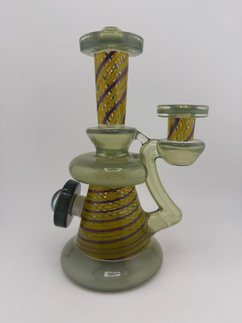 Bowman Glass X Vogel Glass Rettitube featuring vibrant striped design and unique shape, perfect for smoking.