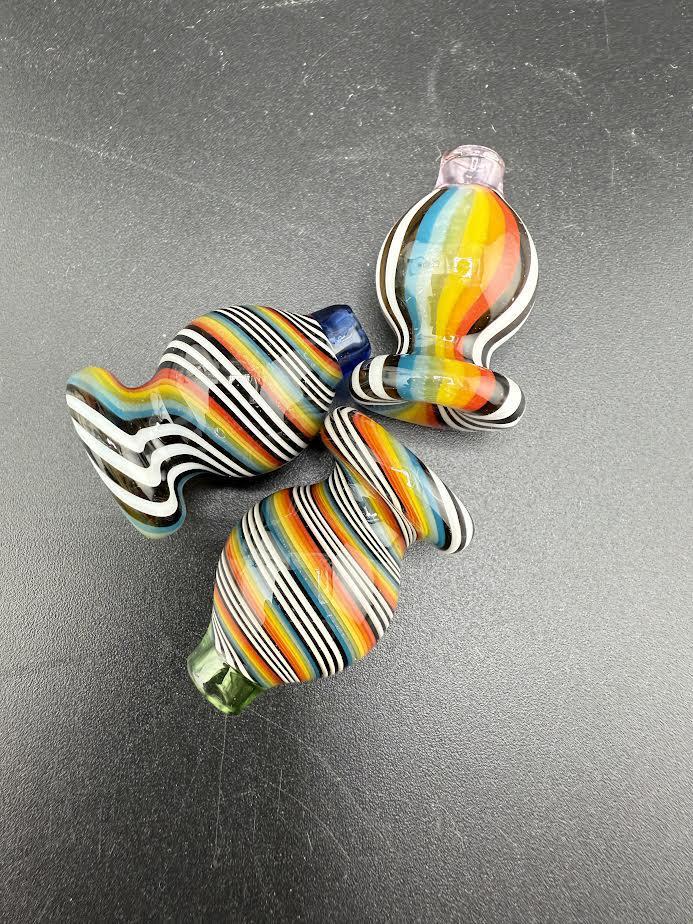 Colorful Puffco Rainbow Bubble Caps with vibrant striped designs, perfect for enhancing your dabbing experience.
