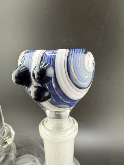 Close-up of Filla John Glass Basic Wig Wag 14mm bowl piece featuring vibrant blue and white wig wag linework.