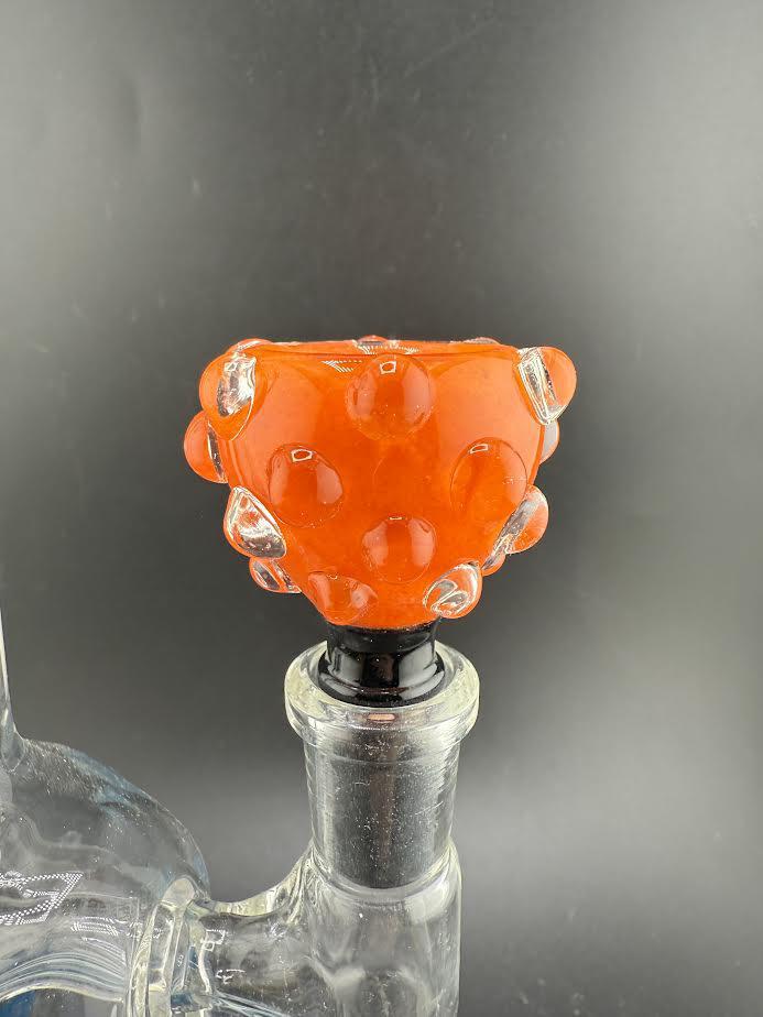 Close-up of a vibrant orange Hob Knob 14mm bowl with bubble accents, showcasing its unique design for smoking accessories.