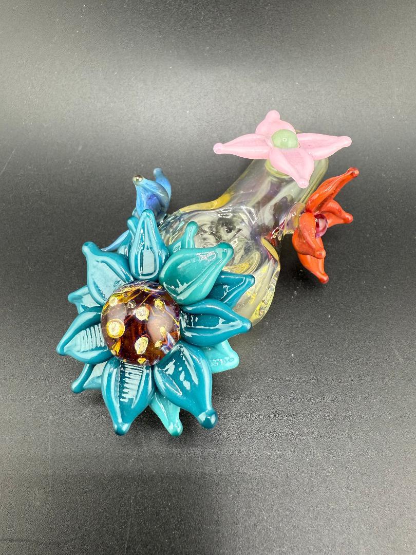 Pablos glass flower hand pipe with vibrant floral designs and colorful accents, perfect for collectors and enthusiasts.