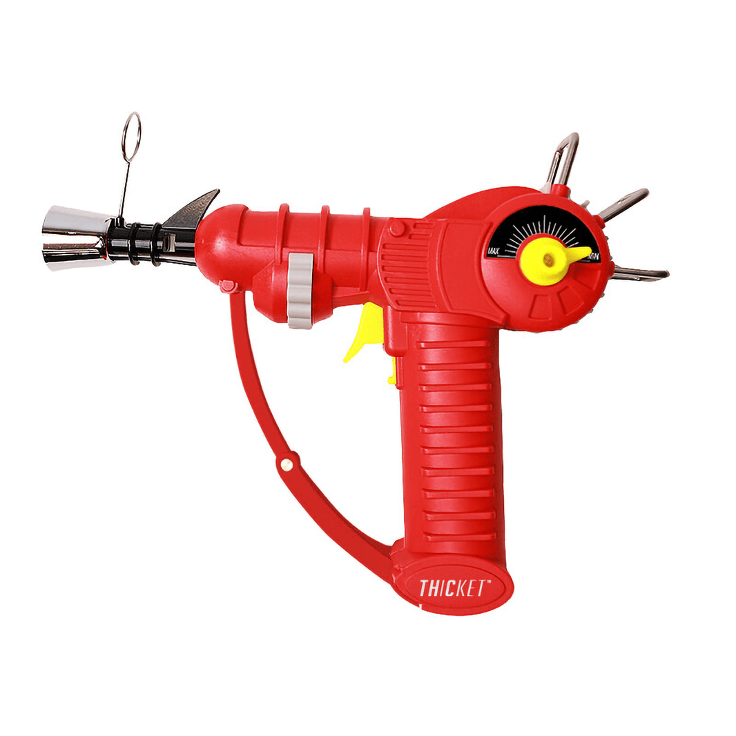 Thicket Spaceout Raygun Butane Torch in red, combining retro sci-fi design with practical functionality.