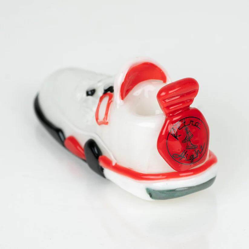 Retro Highz Volume 2 hand pipe designed like a sneaker, featuring a vibrant white and red color scheme.