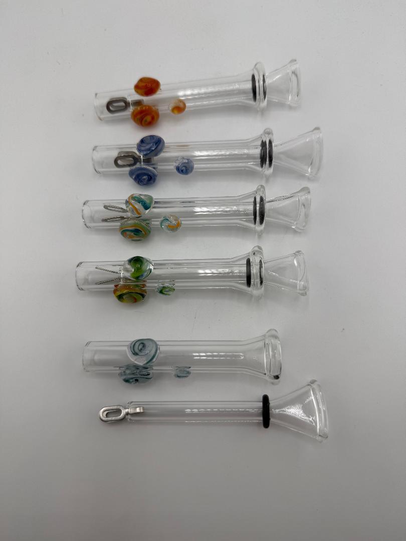 Collection of handcrafted home blown glass sliders with colorful accents, showcasing vibrant designs and unique craftsmanship.