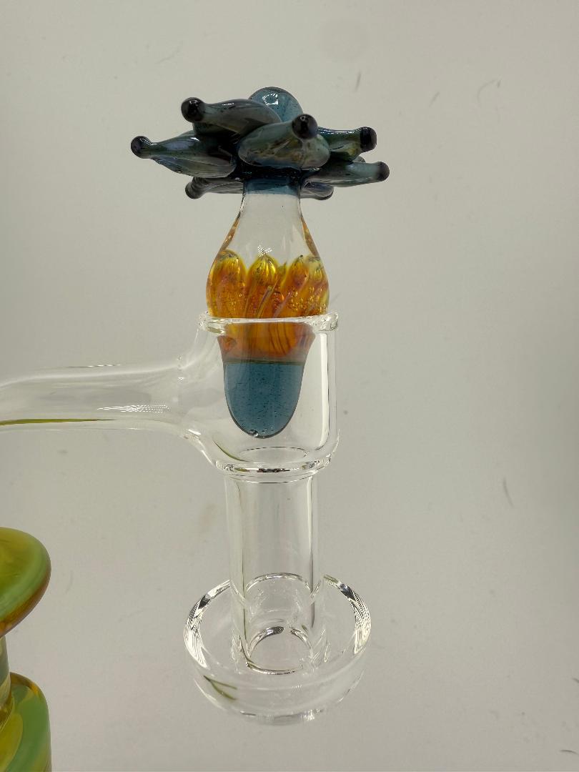 Close-up of Pablos Glass Flower Slurper Top featuring intricate floral design and vibrant colors.