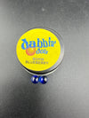 Dabbing Dots - Terp Pearls in a container labeled Bomb Blueberry, featuring two blue glass pearls.