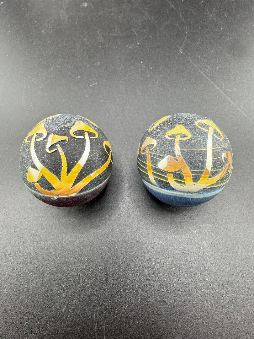 Danny W Glass Marble - 28mm Carved Mushrooms featuring intricate carved mushroom designs.