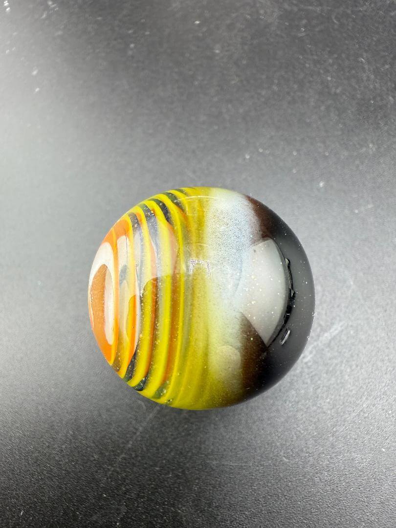 Danny W Glass Marble - 29mm Multi Layered Yellow & Orange showcasing vibrant colors and unique design.