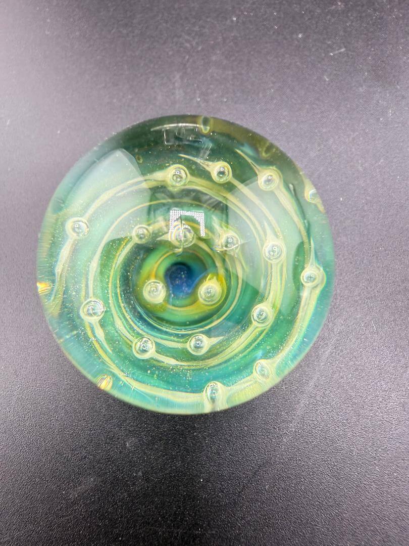 Danny W Glass Marble - 32mm Green Bubble Trap / Implosion showcasing vibrant green spiral design.