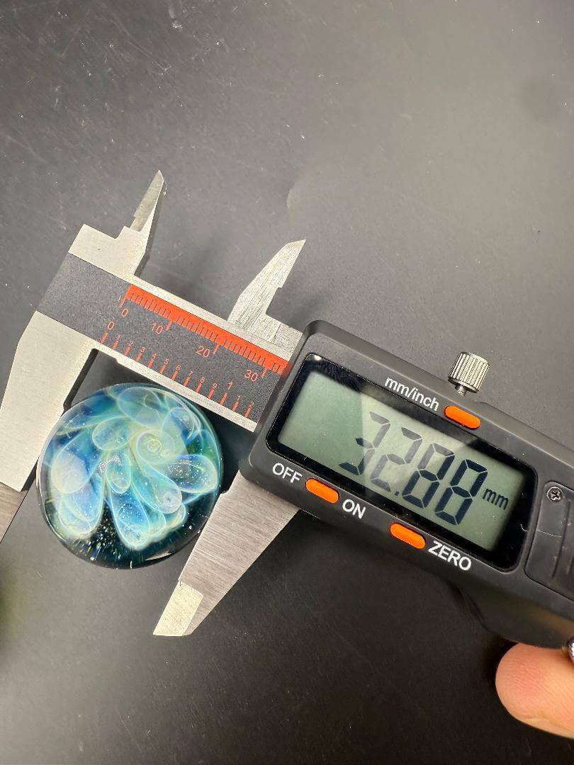 Danny W Glass Marble - 32mm Green Bubble Trap / Implosion measured with caliper showing 32.08mm diameter.