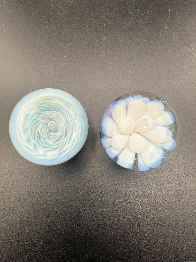 Danny W Glass Marble - 33mm White Implosion, showcasing two unique handcrafted glass designs by Danny W from Spokane.