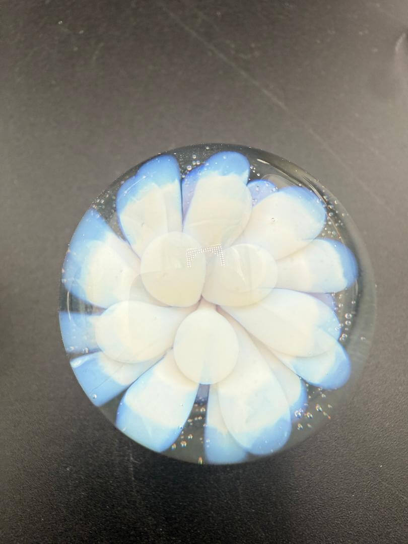 Danny W Glass Marble - 33mm White Implosion showcasing a handcrafted design with white and blue details.