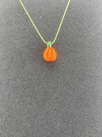 Danny W Halloween Pendant featuring a handcrafted orange pumpkin charm on a colorful necklace.