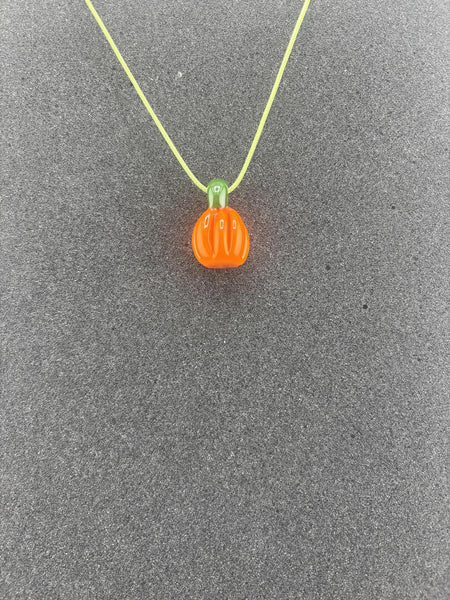Danny W Halloween Pendant featuring a handcrafted orange pumpkin charm on a colorful necklace.