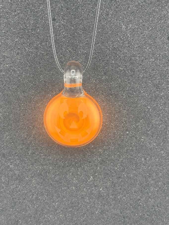 Danny W Jack-O- Lantern Pendant crafted from glass, featuring a smiling pumpkin face in vibrant orange.