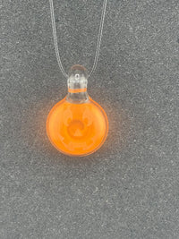 Danny W Jack-O- Lantern Pendant crafted from glass, featuring a smiling pumpkin face in vibrant orange.