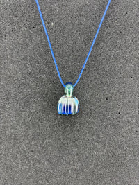Danny W Pumpkin Pendant - Blue handcrafted pendant on a blue cord, showcasing whimsical autumn charm.