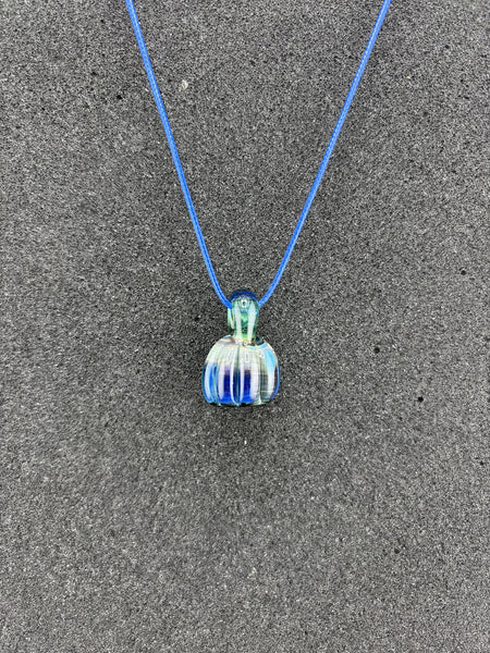 Danny W Pumpkin Pendant - Blue handcrafted pendant on a blue cord, showcasing whimsical autumn charm.