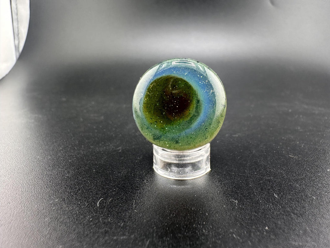 Danny W Smaller Mushroom Implosion Marble / Paperweight featuring vibrant colors and a unique 3D effect.