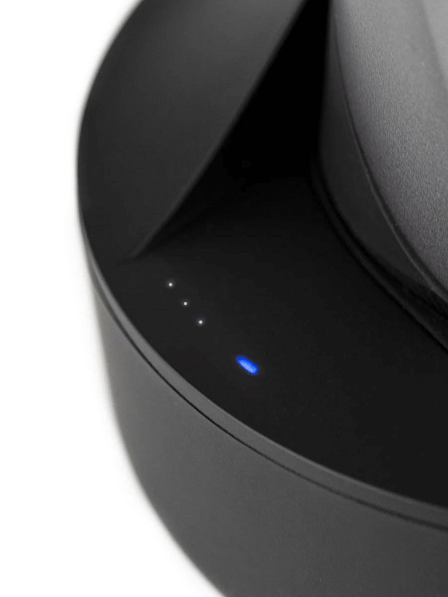 Close-up of the Puffco Peak Pro Power Dock showing battery level indicators and charging LED light.