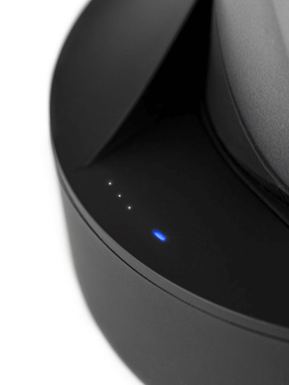 Close-up of the Puffco Peak Pro Power Dock showing battery level indicators and charging LED light.