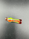Colorful glass pipe with red, orange, blue and green stripes on a black background