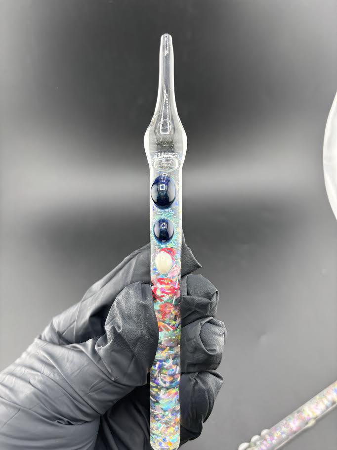 Dollhouse Glass Glitter Dab Tool with colorful glitter designs in a clear handle, perfect for adding sparkle to your sesh.