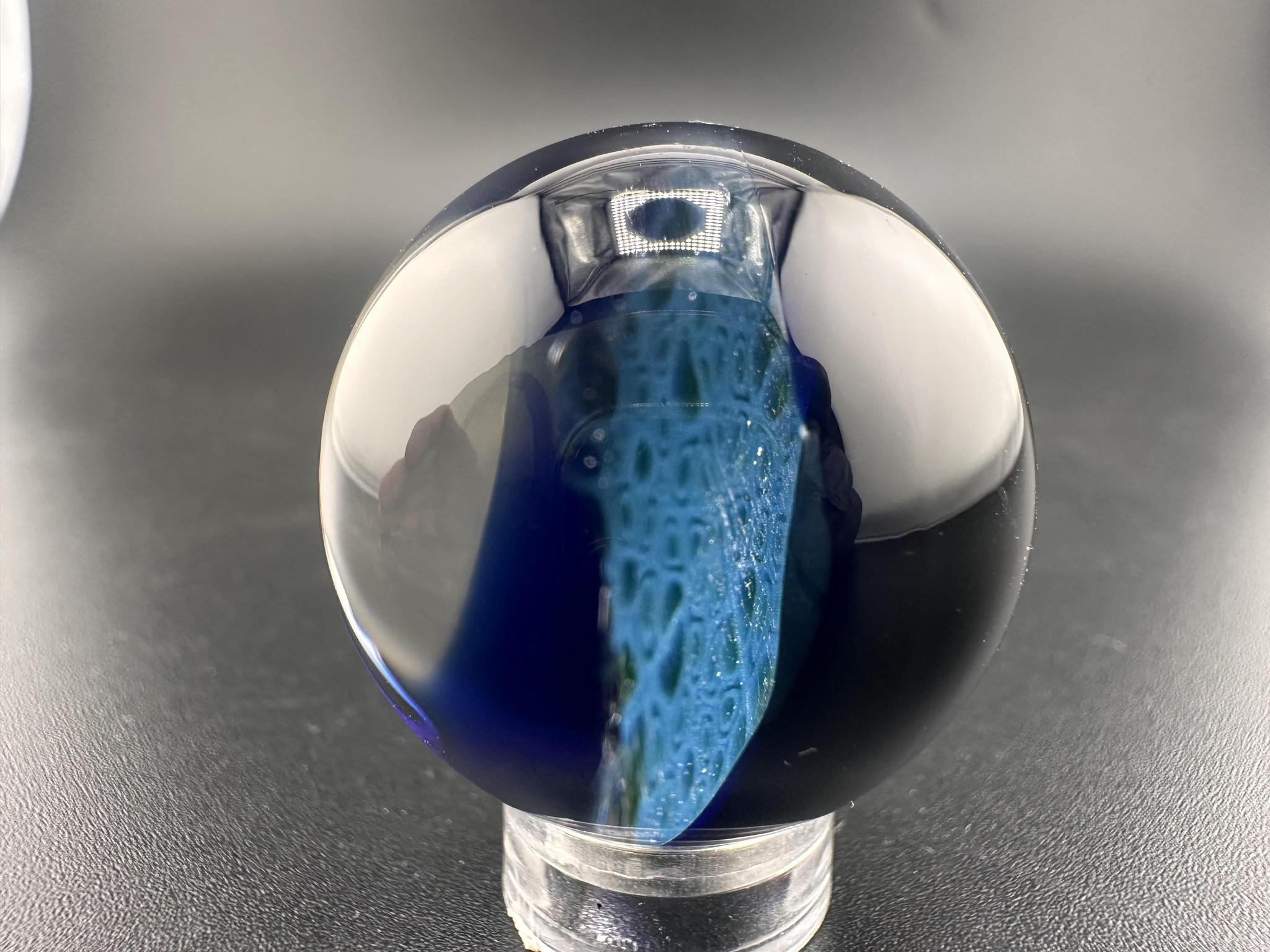Domer Glass Marble - Blue Mitosis Millie Chip Stack UV showcasing vibrant blue and swirling patterns.