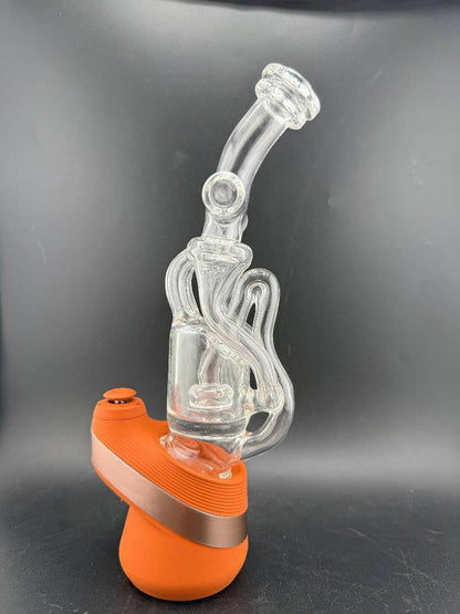 Domer Glass Puffco Peak Glass Attatchment - Double recycler showcased next to vibrant orange base.