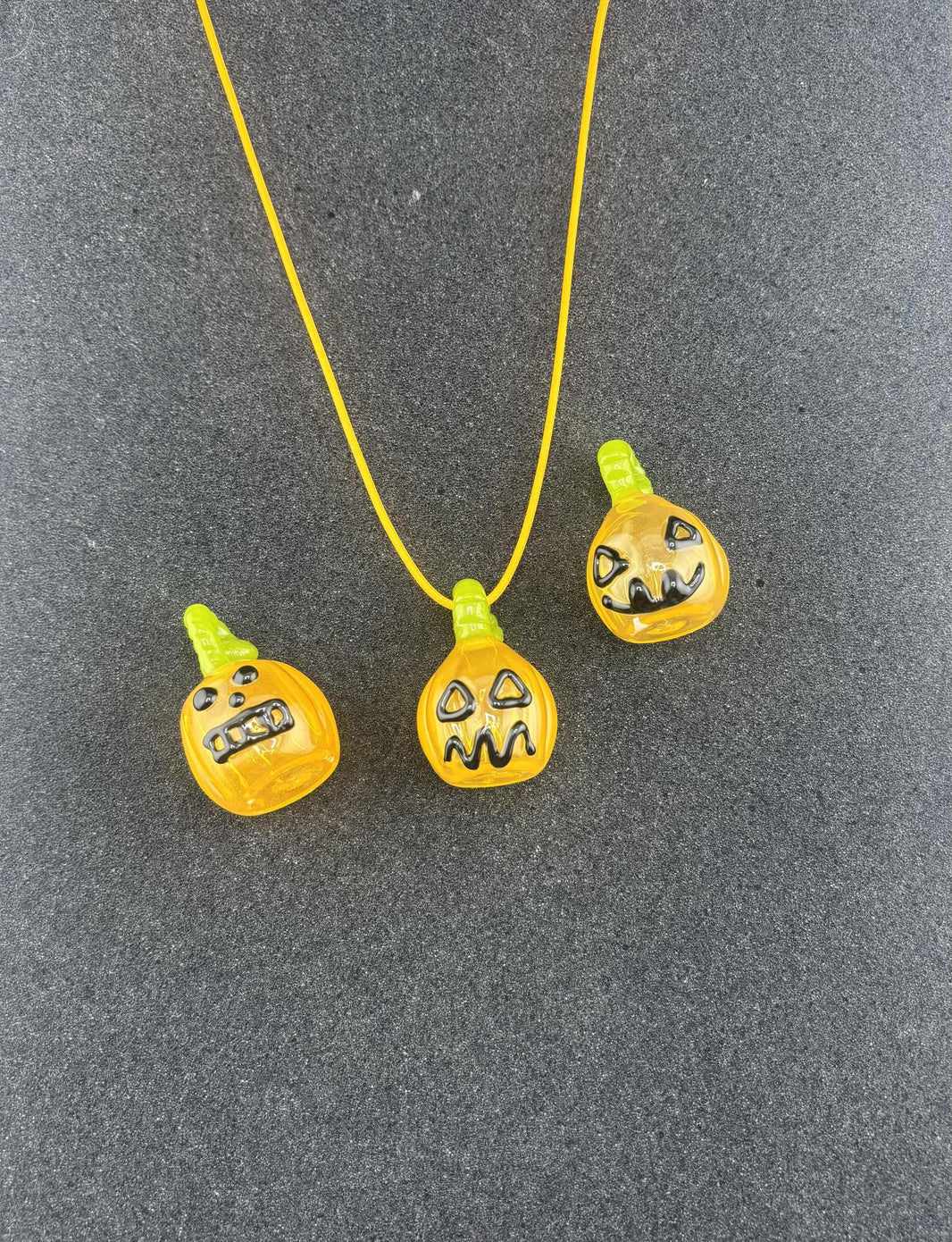 Domer Holloween Pumpkin Pendants: unique handcrafted pumpkin pendants in vibrant yellow, featuring distinct faces and charm.