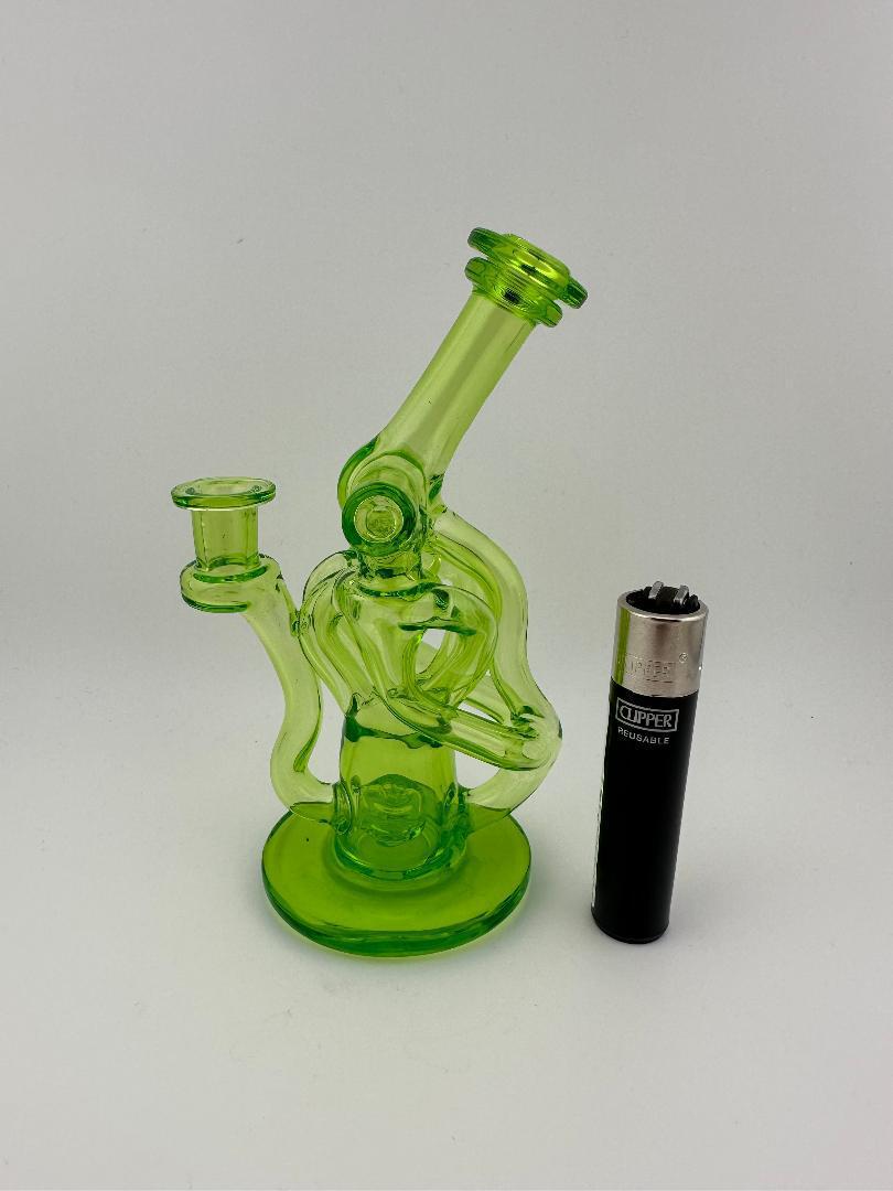 Domer Glass Double Drain Quad Uptake Mini Recycler in green, showcasing efficient filtration and design with a lighter for scale.