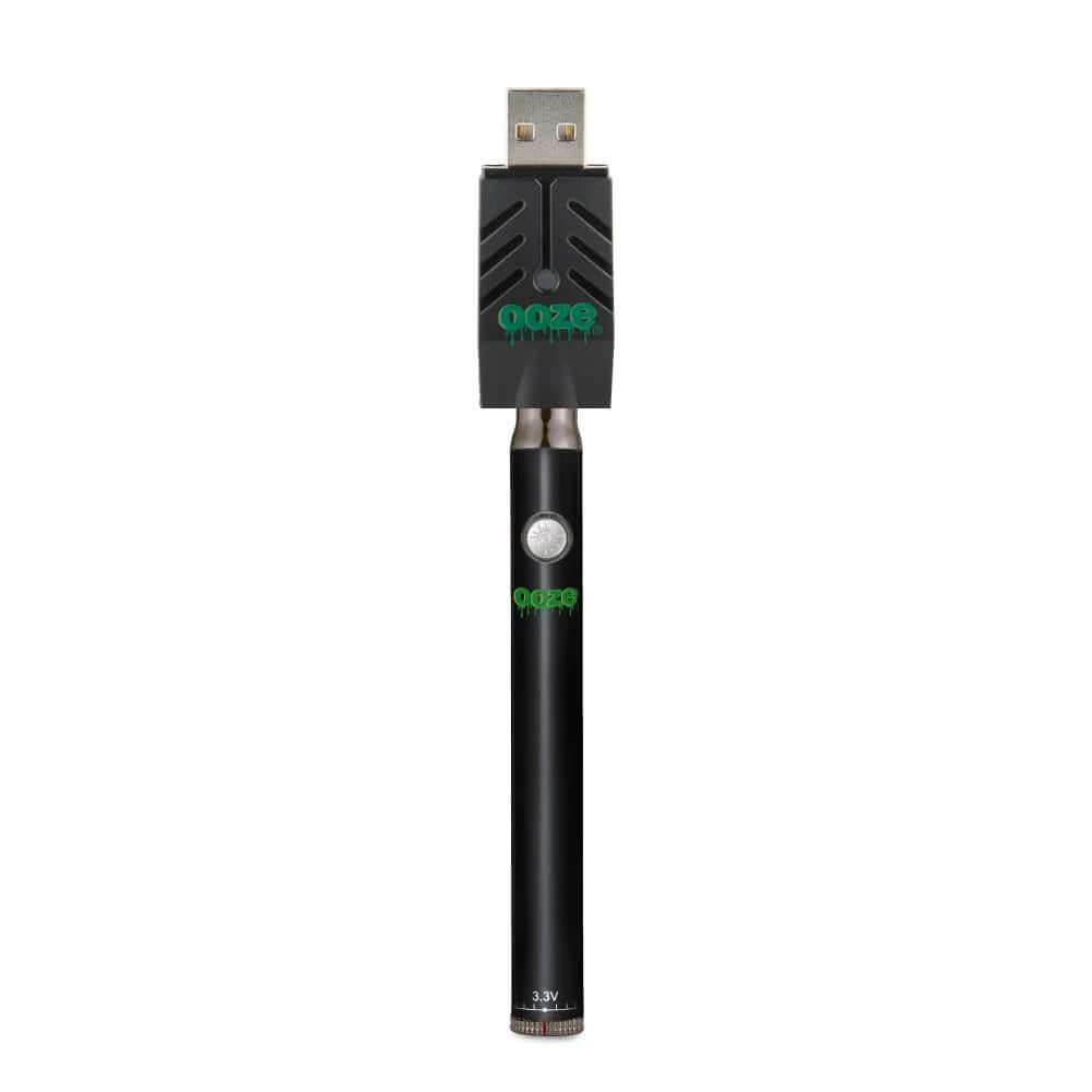 Sleek Ooze Twist Pen Slim vape battery with USB charger, compatible with 510 thread cartridges and wax attachments.
